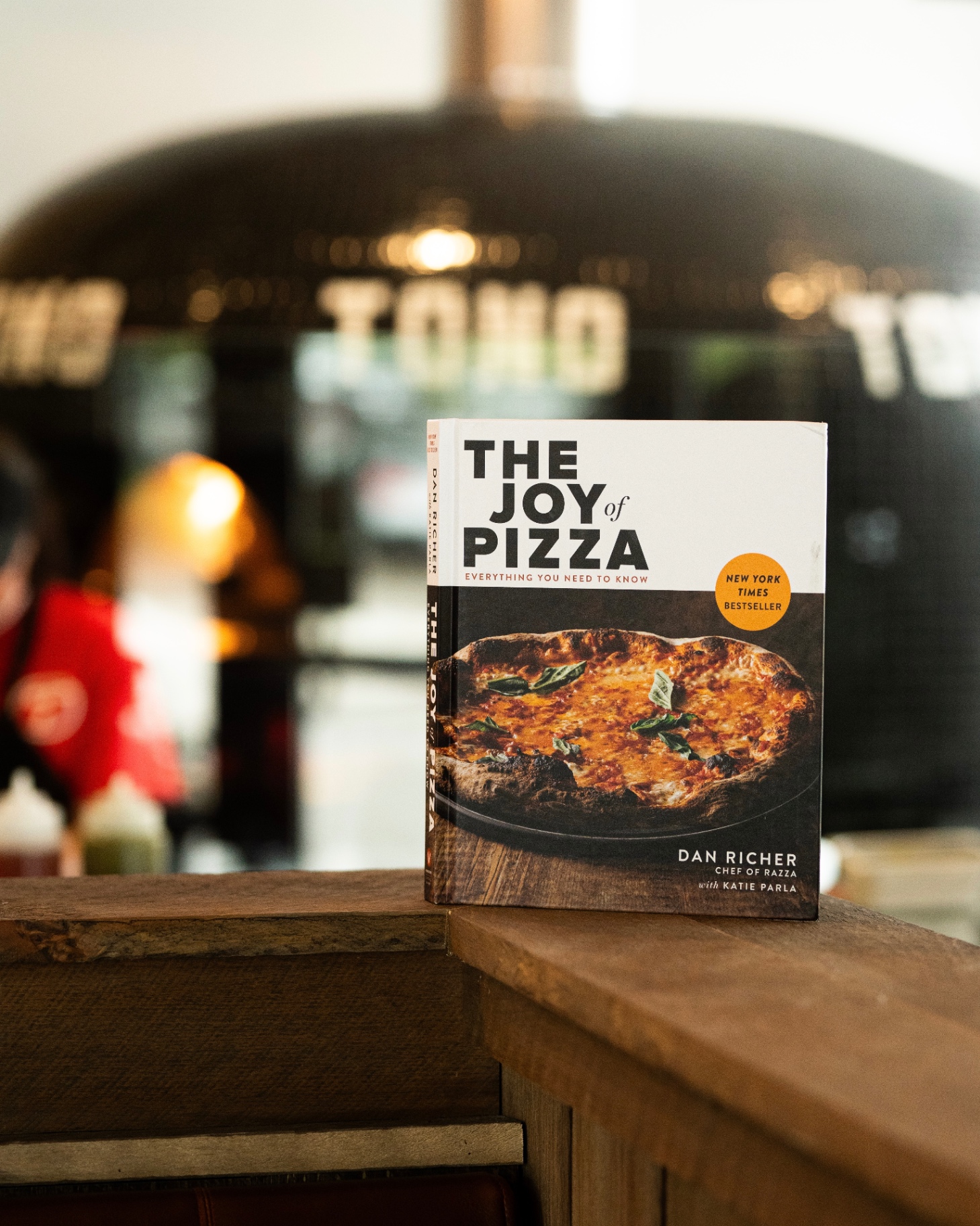 The Joy of Pizza cookbook on Tono counter