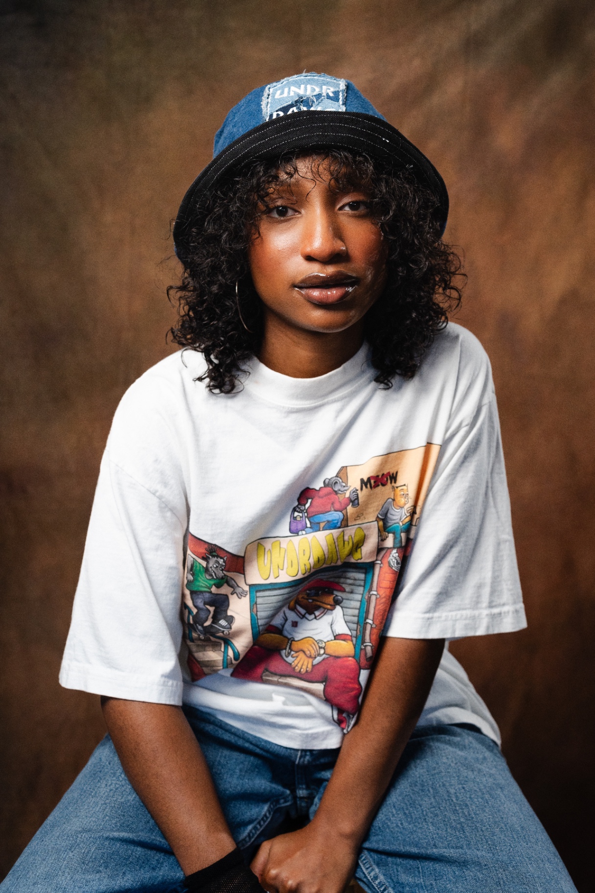 Undrdawg graphic tee portrait with denim hat