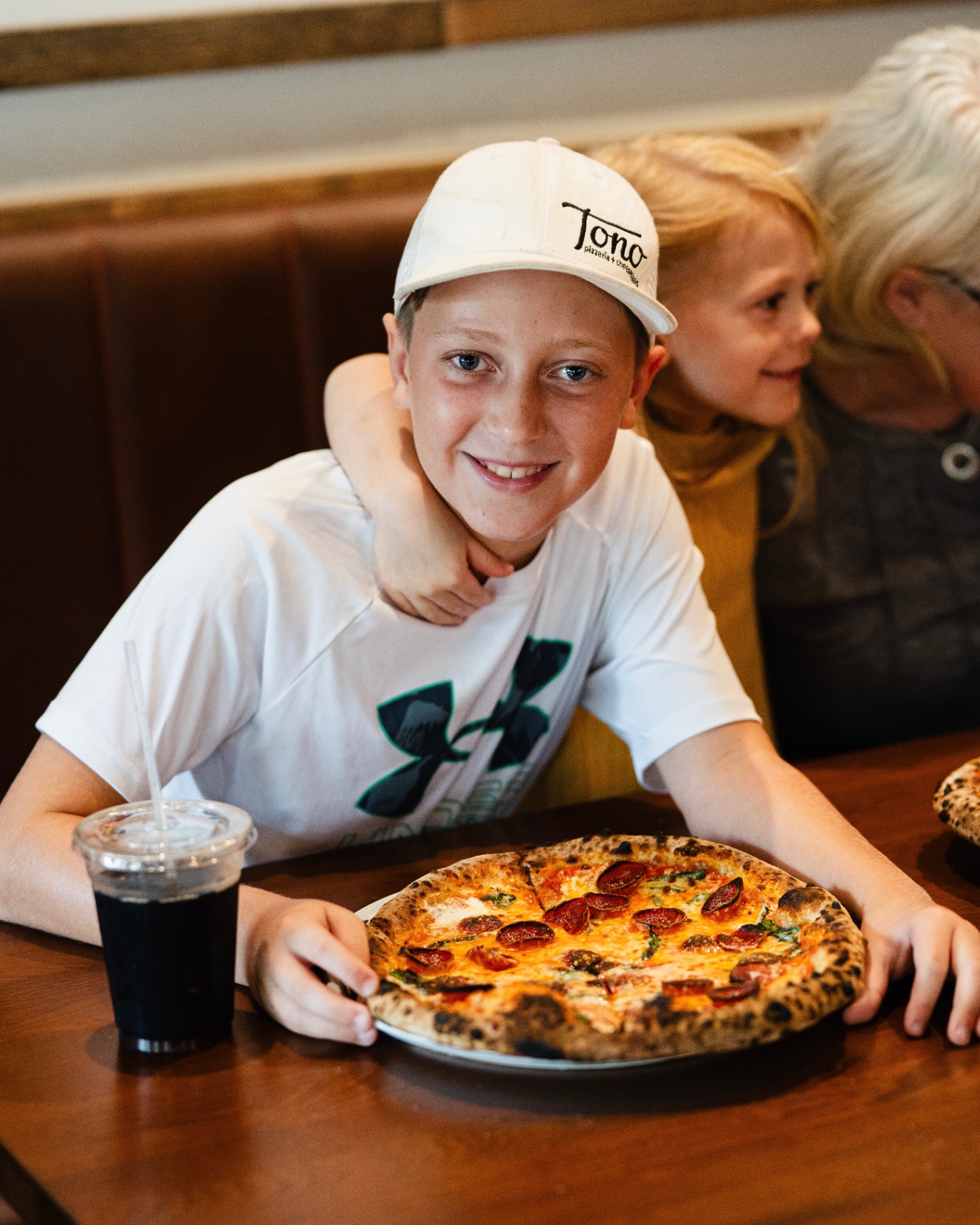 Young Tono fan with pepperoni pizza