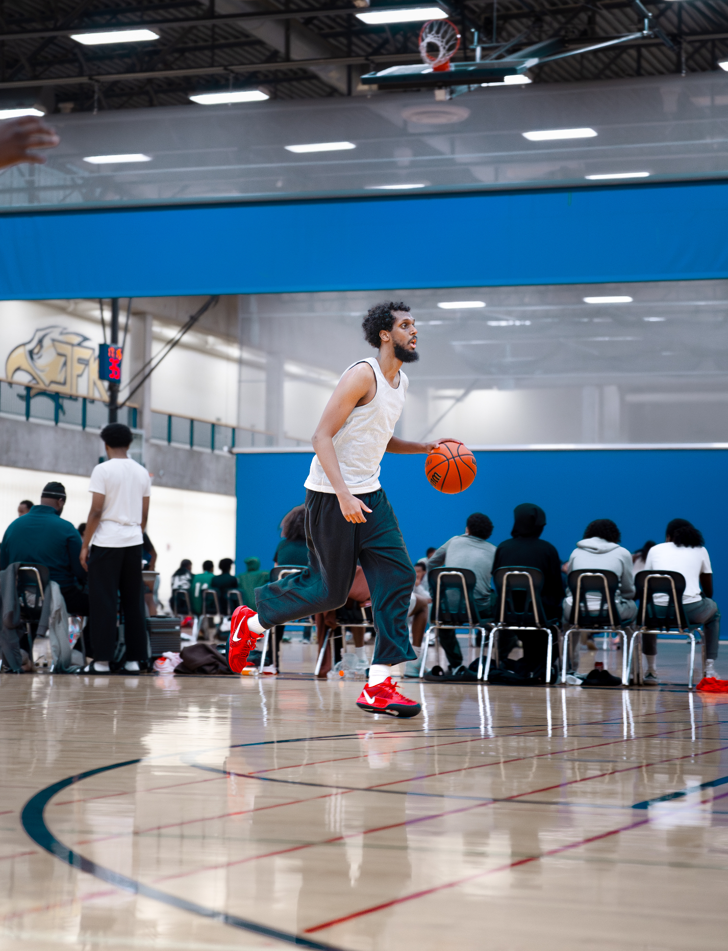STMN player driving up the court